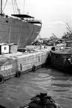 Unloading goods at the docks Saigon